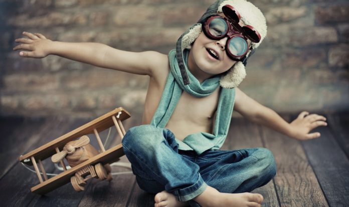 boy_toy_airplane_helmet_glasses_jeans_mood_4000x2925